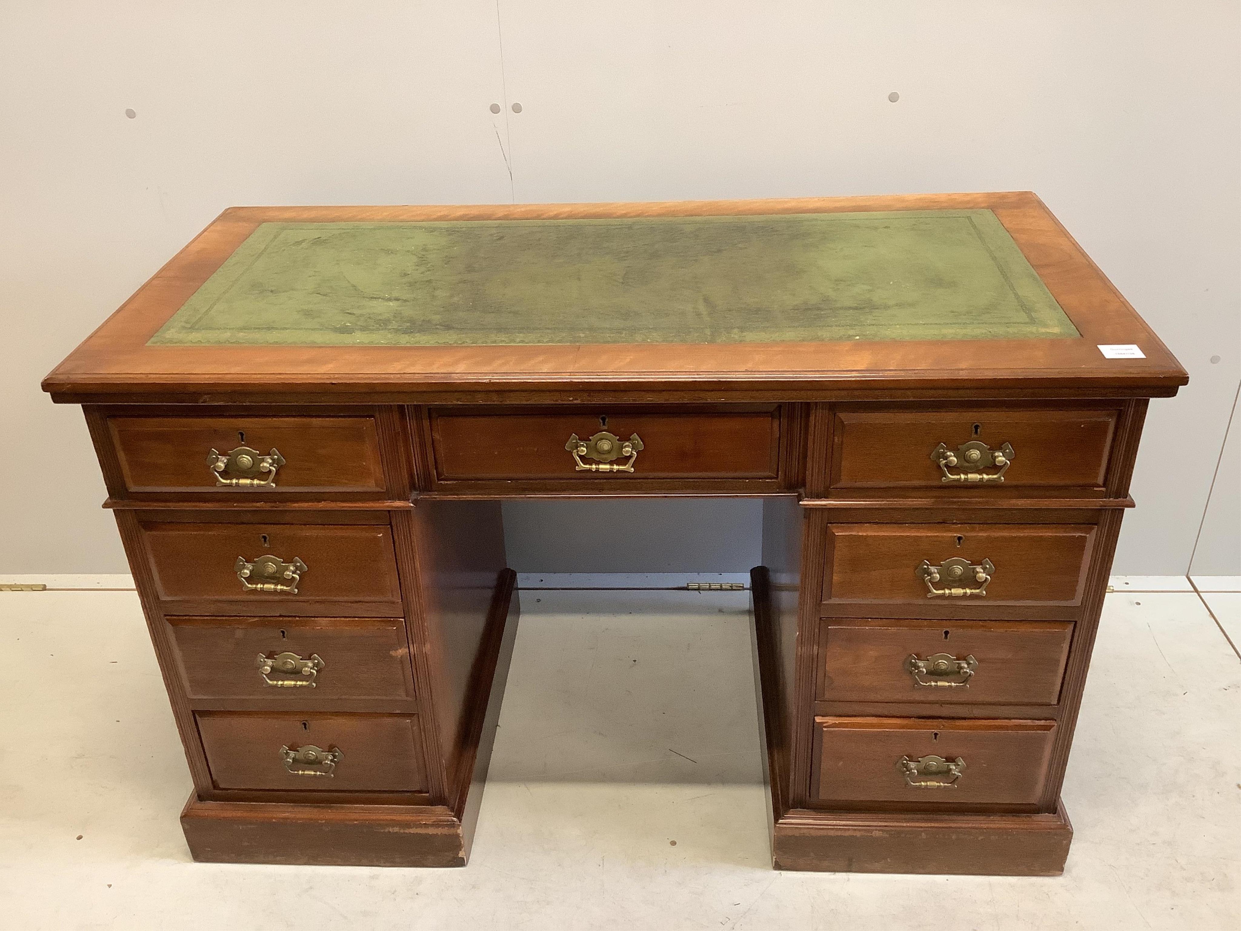 A late Victorian mahogany kneehole pedestal desk, fitted nine small drawers, width 121cm, depth 59cm, height 77cm. Condition - fair to good